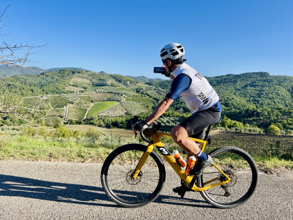 Cyclist takes photos of vineyards of Chianti Classico whilst riding 
